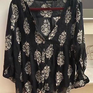 Lucky be a lady tonight in this lovely black top